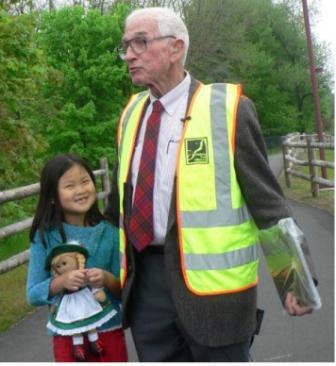 John Andrews at bridge dedictation with his granddaughter, Iulia, 6. (Staff photo by Kate Irish Collins) 